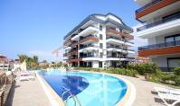 AL-1994, Balkon mit Blick auf den Pool und Hallenbad – Möblierte 75 m² große 1+1-Wohnung mit Hamam, Fitnessraum und Aufenthaltsgenehmigung für Touristen, Oba