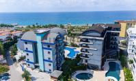 AL-2129, Direkt am Meer: 2023 erbaute, möblierte 55 m² große 1+1-Wohnung mit Pool, Sauna und Fitnessraum, Kargıcak