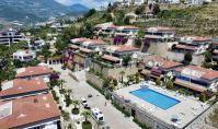 AL-2131, Eigener Garten und Meerblick – Möblierte 100 m² große 2+1-Wohnung im Erdgeschoss mit Pool, Sauna und Fitnessraum, Kargıcak
