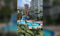 AL-2154, Pool mit Wasserrutschen unterhalb des Balkons – Möblierte 62 m² große 1+1-Wohnung mit Innenpool und Hamam, Cikcilli