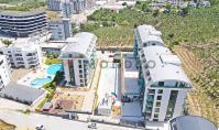 AL-2211, Garten-Duplex mit großer Terrasse – Neubau, 100 m², 2+1 Zimmer, zwei Badezimmer, Hamam, Sauna und Pools mit Wasserrutsche, Kargicak