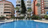 AL-2243, Lage direkt am Meer – Möblierte 120 m² große 2+1-Wohnung mit Pool, Garten sowie Meer- und Stadtblick, Mahmutlar