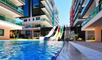 AL-2396, Komplex direkt am Strand mit Innenpool und Spa: Möblierte 65 m² große 1+1-Wohnung im 4. Stock mit Meerblick, Kargicak